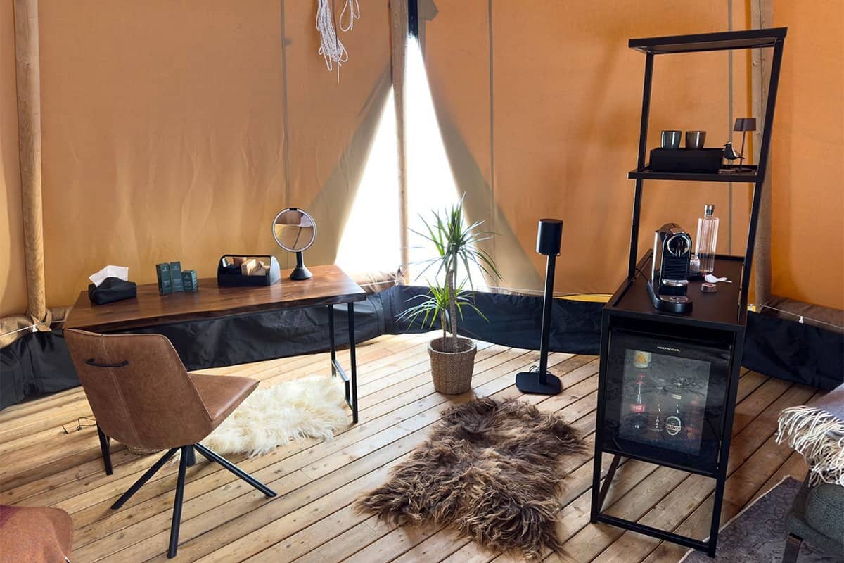 Relaxation area with minibar and makeup station inside the tipi