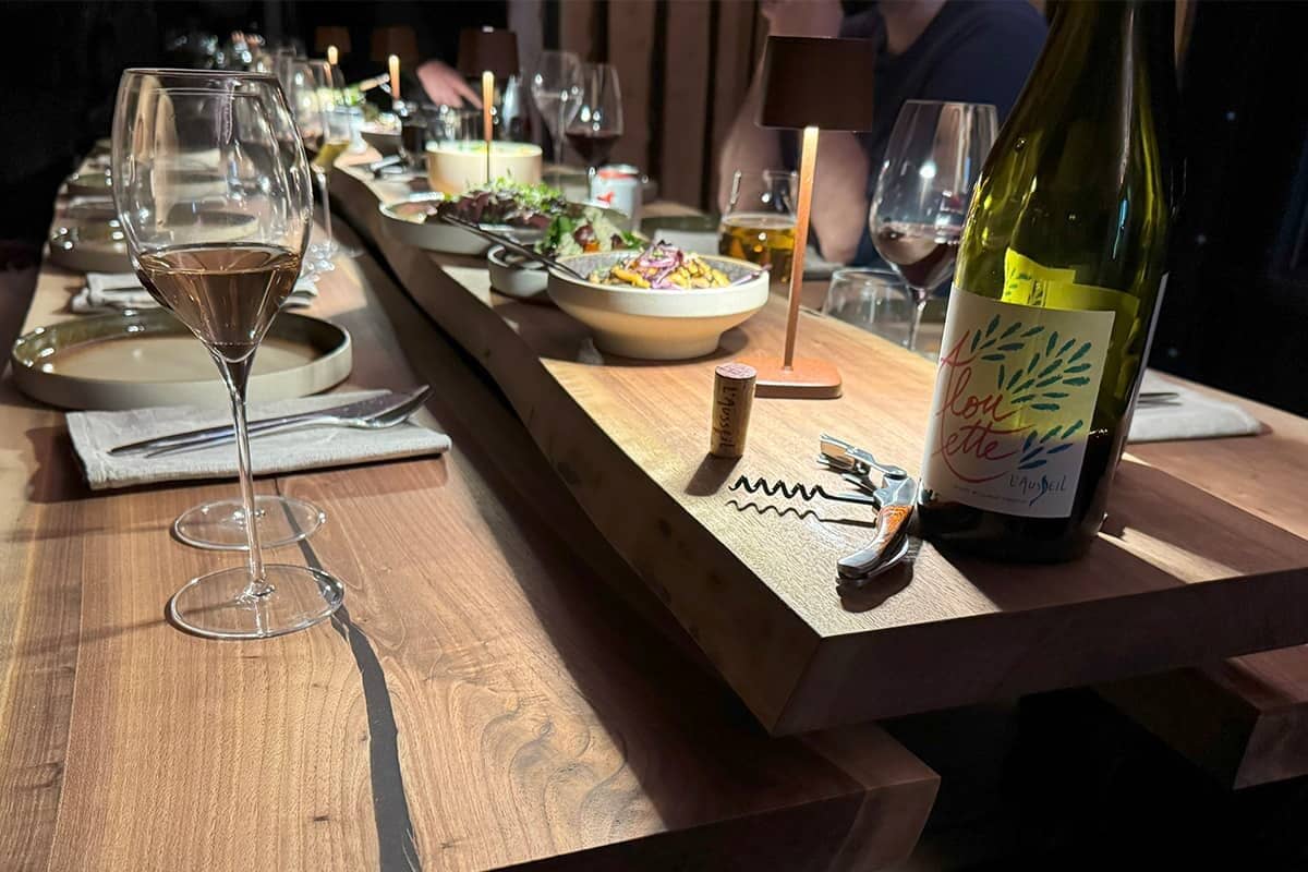 Table set with gourmet meals and wine pairings